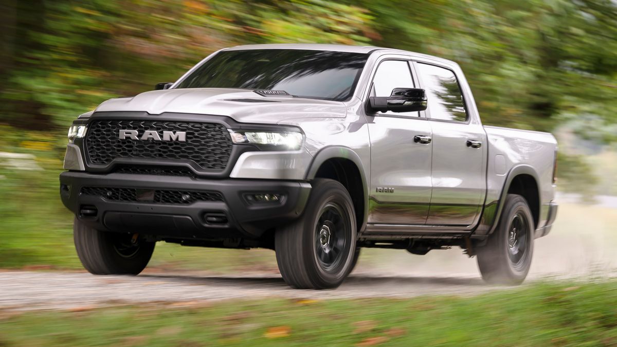 2025 Ram 1500 Rebel driving down a dirt road.