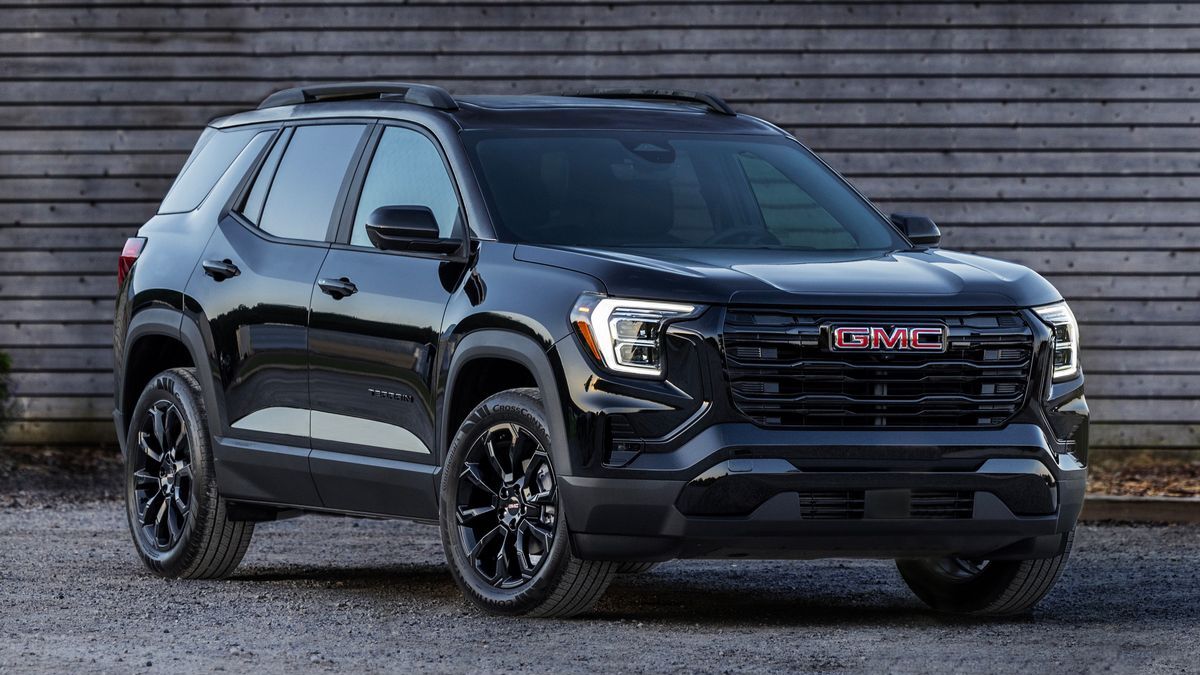 2025 GMC Terrain Elevation in black parked next to a barn.